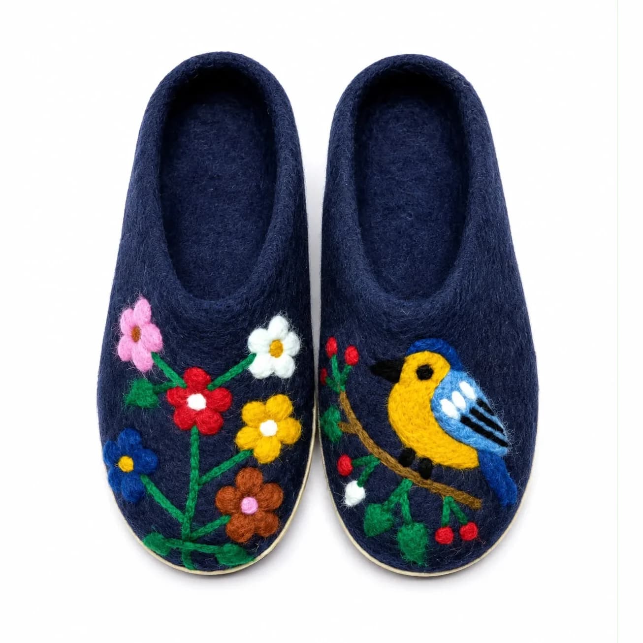Midnight blue hand-felted wool slippers with a needle-felted yellow bird and wildflower motif